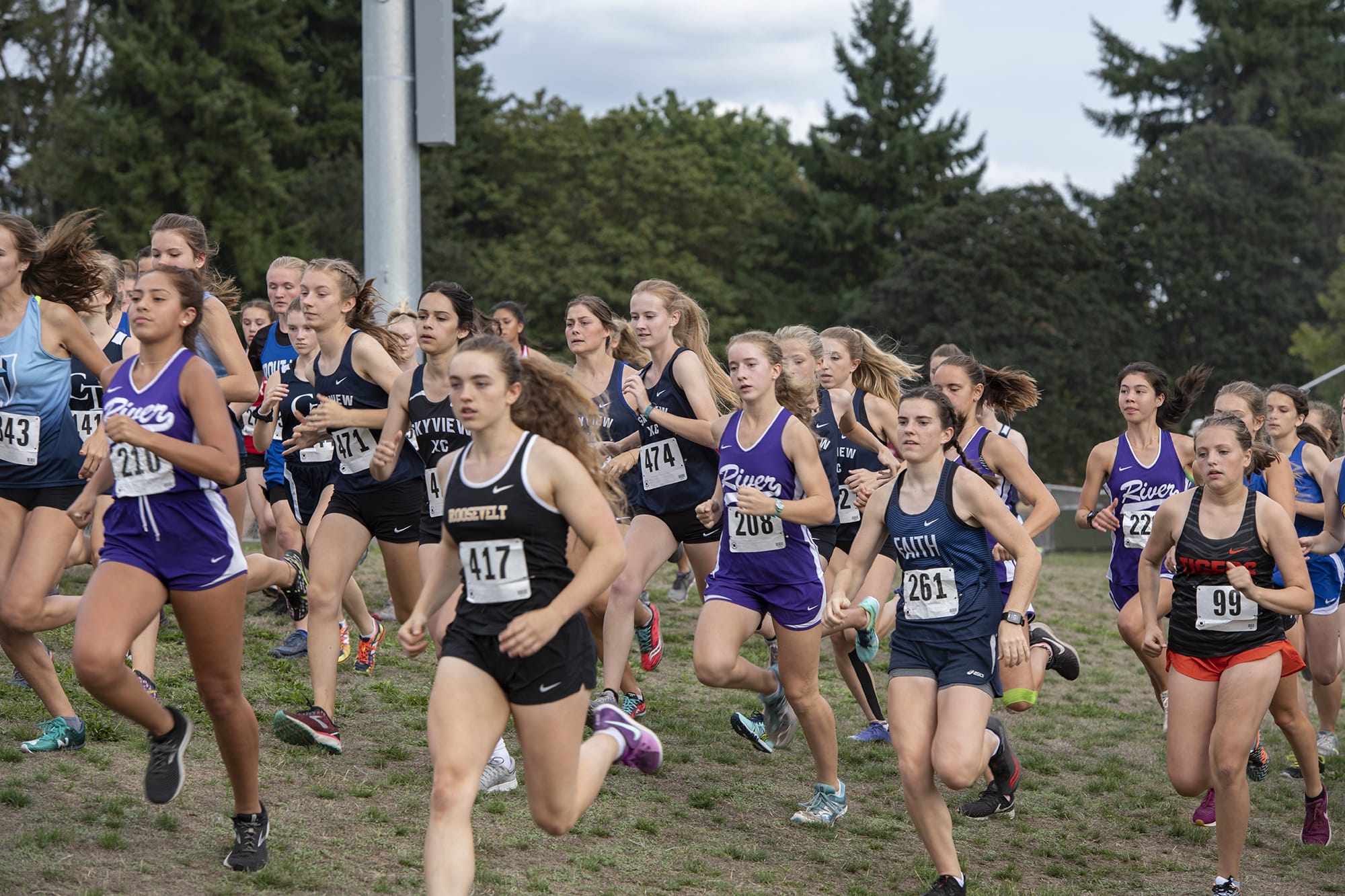 Girls varsity participants take off from the starting line during the Steve Maas Hudson's Bay Run-A-Ree cross country meet at Hudson's Bay High School on Friday afternoon, September 13, 2019.