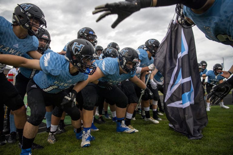 The Hawks pump each other up before Friday nightÕs game against Archbishop Murphy in Hockinson on Sept. 13, 2019. The HawkÕs lost 21-27.