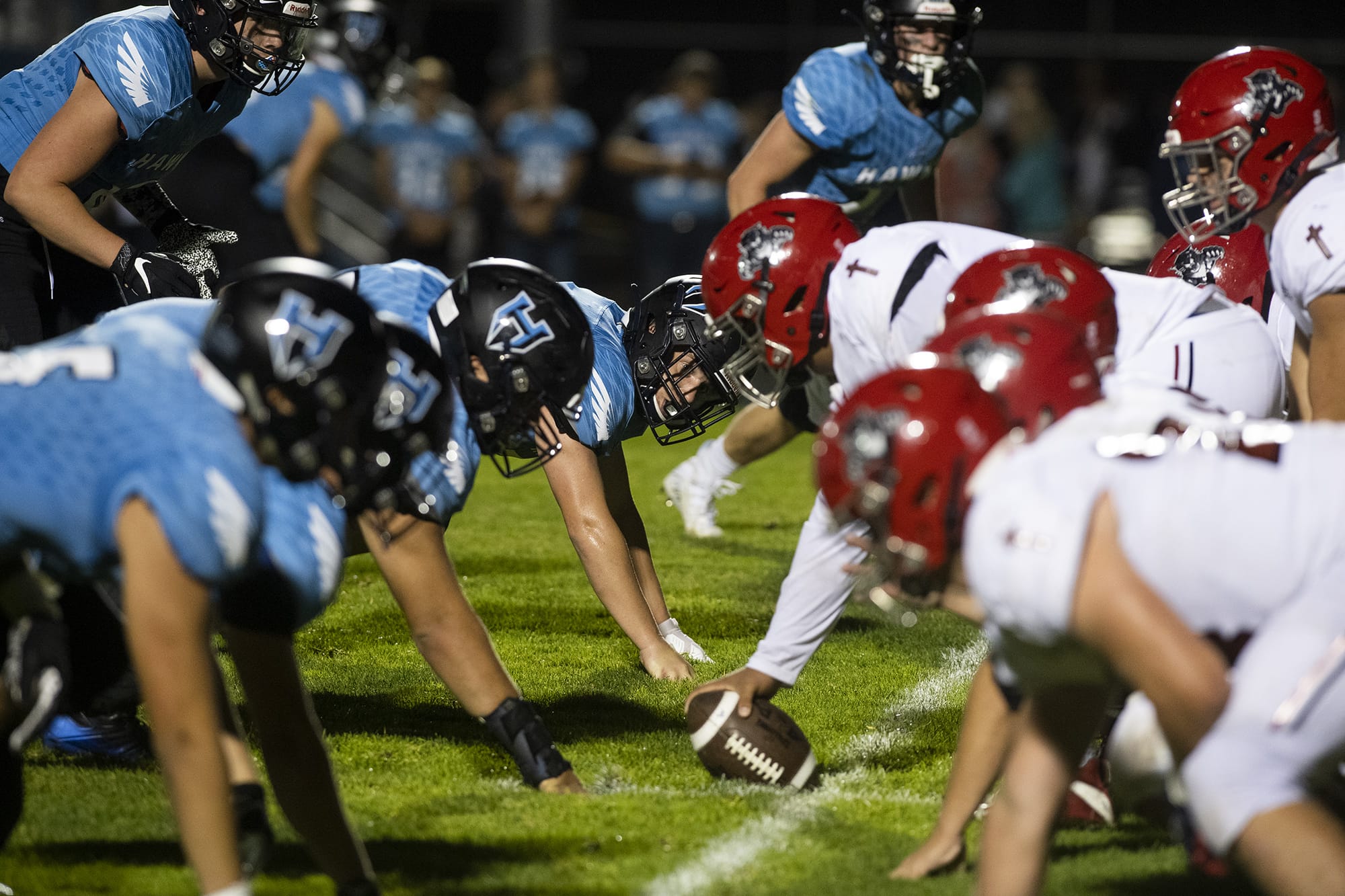 Hockinson and Archbishop Murphy face off at the line of scrimmage during Friday nightÕs game in Hockinson on Sept. 13, 2019. The HawkÕs lost 21-27.