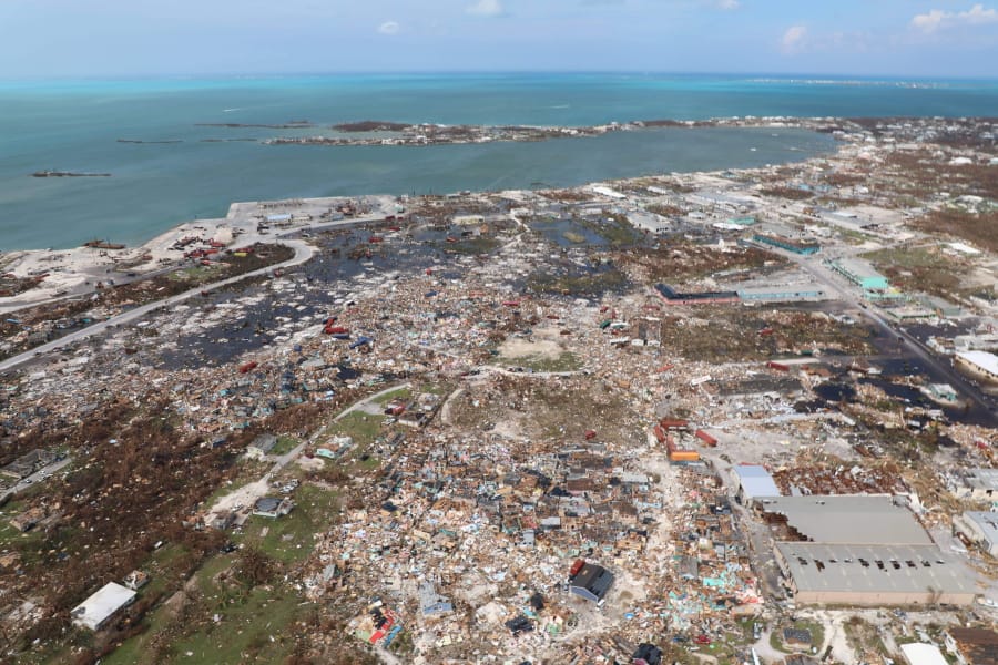 The destruction caused by Hurricane Dorian is seen from the air, in Marsh Harbor, Abaco Island, Bahamas, Wednesday, Sept. 4, 2019. The death toll from Hurricane Dorian has climbed to 20. Bahamian Health Minister Duane Sands released the figure Wednesday evening and warned that more fatalities were likely.