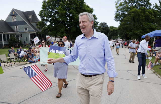In this July 4, 2019, file photo, Democratic presidential candidate New York Mayor Bill de Blasio walks in the Independence Fourth of July parade in Independence, Iowa. de Blasio said Friday, Sept. 20 that he is ending his campaign for the Democratic presidential nomination.