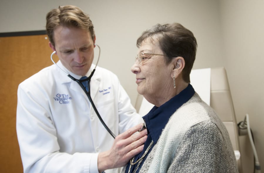 Cardiologist Dr. Nathan Boyer follows up with patient Sharon Parks at Vancouver Clinic in 2016. Parks, 69, was the first patient in Clark County to undergo a new cardiac procedure called TAVR. The procedure was initially only available to the most high-risk patients, but has been expanded to all risk levels.