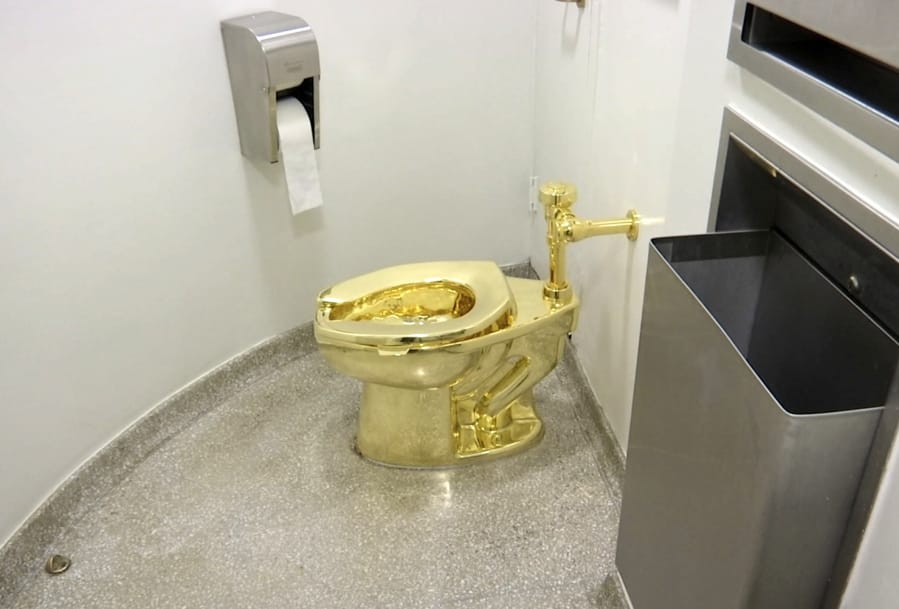 This 2016 file image shows the 18-karat toilet, titled &quot;America,&quot; by Maurizio Cattelan, in the Solomon R. Guggenheim Museum in New York.
