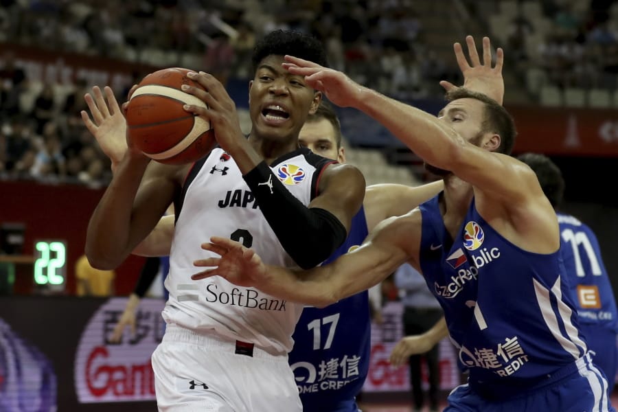 Japan’s Rui Hachimura keeps the ball from Czech Republic’s Martin Kriz during a Group E match for the FIBA Basketball World Cup at the Shanghai Oriental Sports Center in Shanghai on Tuesday, Sept. 3, 2019.