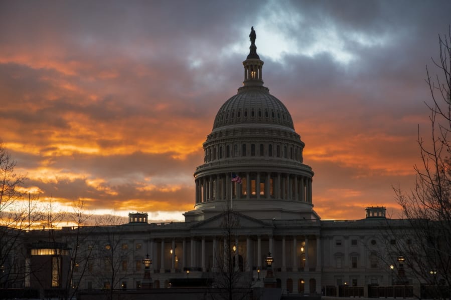 FILE - In this Jan. 24, 2019, file photo, the Capitol at sunset in Washington. Facing criticism that the Senate has become little more than what one member calls “an expensive lunch club,” Congress returns for the fall session with pressure mounting on Leader Mitch McConnell to address gun violence, election security and other issues. (AP Photo/J.