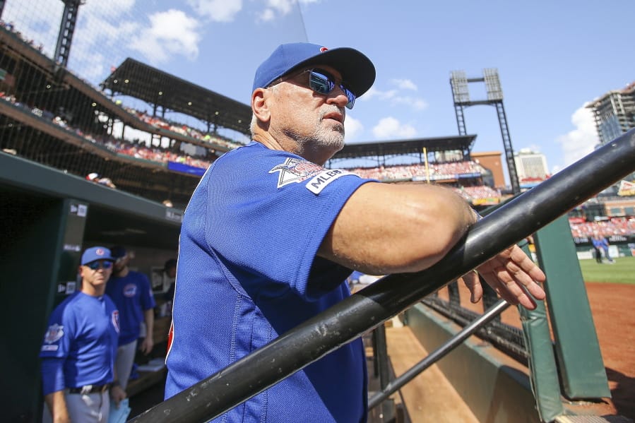 Chicago Cubs manager Joe Maddon looks out from the dugout prior to a baseball game against the St. Louis Cardinals, Sunday, Sept. 29, 2019, in St. Louis.