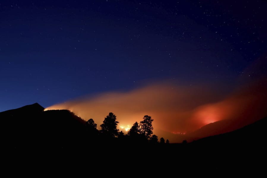 Pockets of wildfires are visible July 21 within the Museum fire on the slopes of the San Francisco Peaks near Flagstaff, Ariz. Monsoon season carries high hopes for rain, thunder and lightning across the Southwest, but it failed to deliver this year.