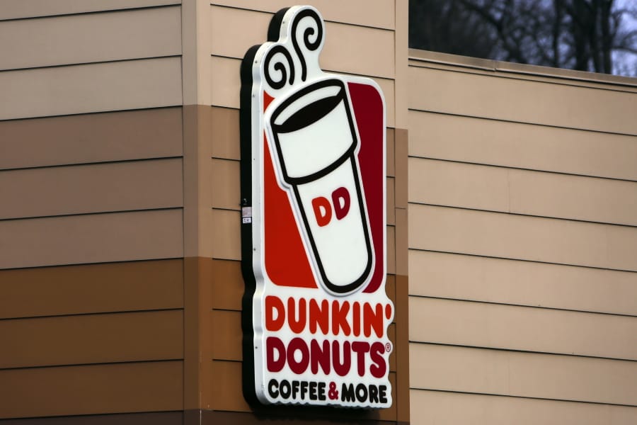 FILE- This Jan. 22, 2018, file photo shows the Dunkin&#039; Donuts logo on a shop in Mount Lebanon, Pa. Dunkin&#039; Donuts violated state law by not notifying almost 20,000 customers, including more than 2,000 in New York, about cyberattacks on their accounts in 2015 and inadequately warning more than 300,000 customers in 2018 about another attack, the New York state attorney general said Thursday, Sept. 26, 2019, in announcing a lawsuit. (AP Photo/Gene J.