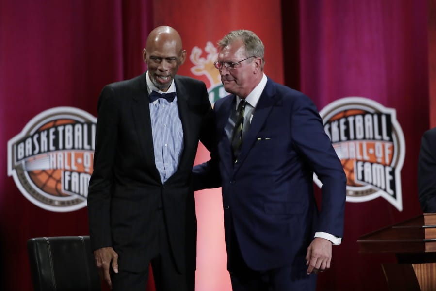 Inductee Jack Sikma, right, stands with presenter Kareem Abdul-Jabbar at the Basketball Hall of Fame enshrinement ceremony Friday, Sept. 6, 2019, in Springfield, Mass.