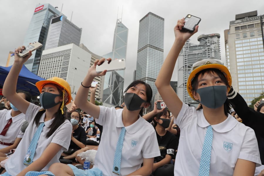 Students wear protective gear during a protest in Hong Kong, Monday, Sept. 2, 2019. Hong Kong has been the scene of tense anti-government protests for nearly three months. The demonstrations began in response to a proposed extradition law and have expanded to include other grievances and demands for democracy in the semiautonomous Chinese territory.