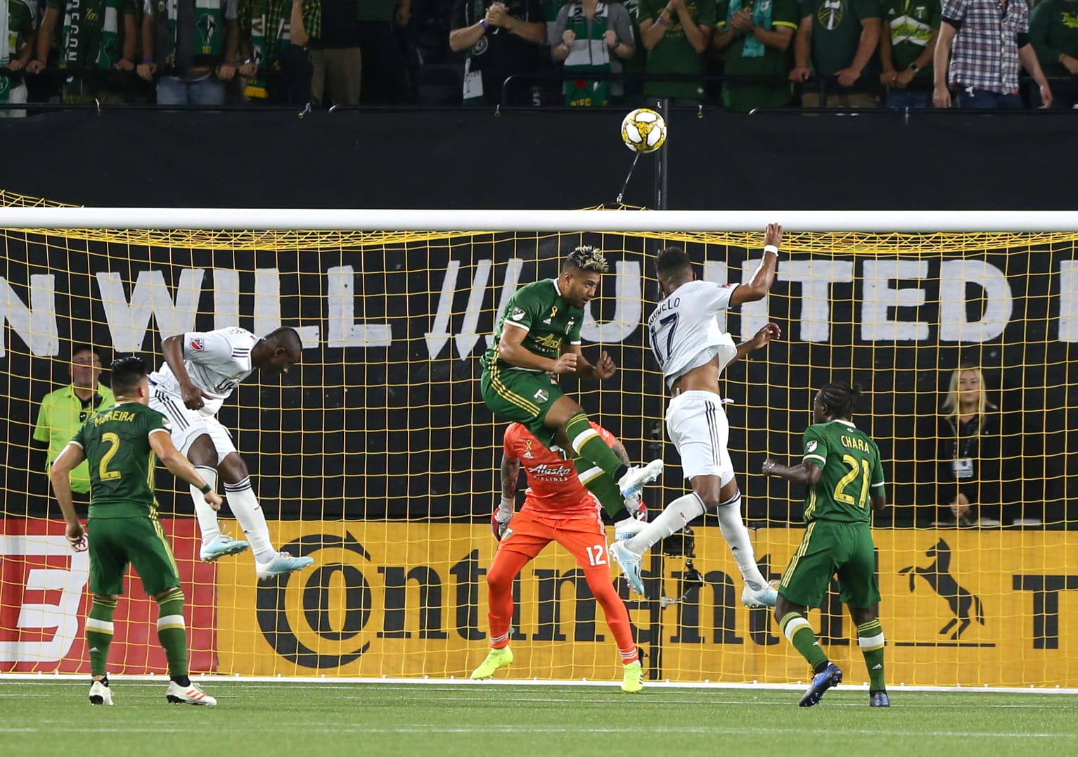 New England Revolution's Juan Agudelo (17) tries to head the ball toward the goal during the team's MLS soccer match against the Portland Timbers on Wednesday, Sept. 25, 2019, in Portland, Ore.