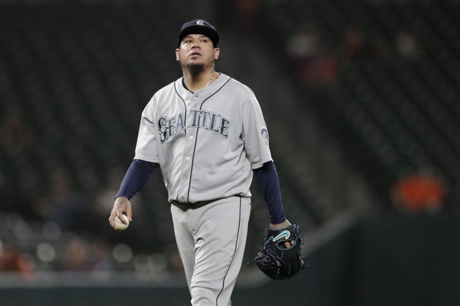 Seattle Mariners starting pitcher Felix Hernandez looks on between batters during the first inning of a baseball game against the Baltimore Orioles, Friday, Sept. 20, 2019, in Baltimore.