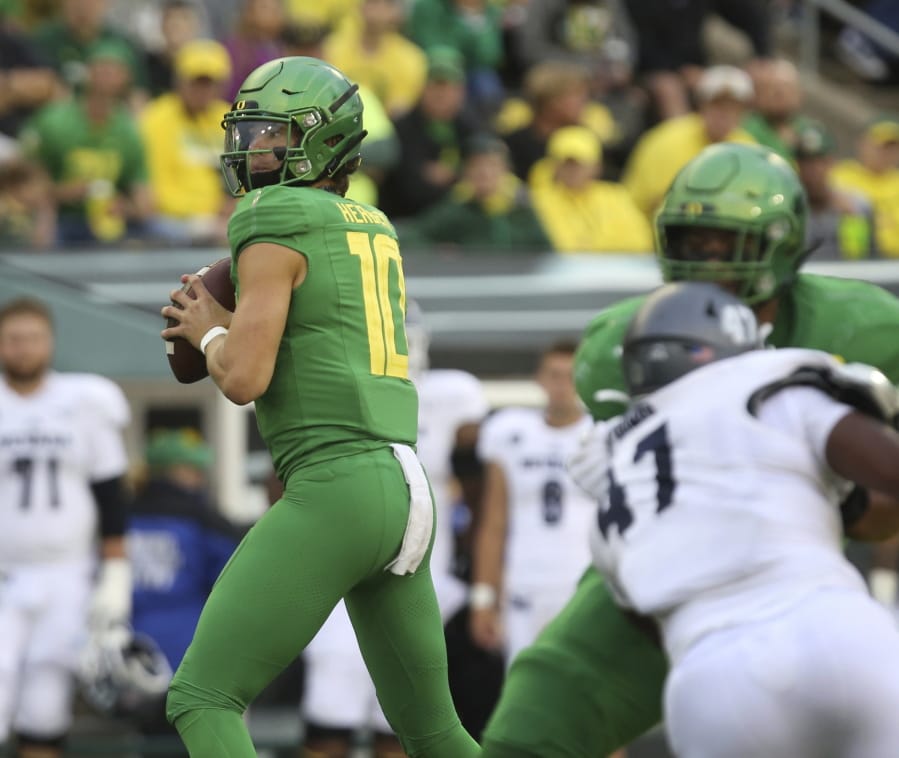 Oregon’s Justin Herbert looks for a receiver during the third quarter of the team’s NCAA college football game against Nevada on Saturday, Sept. 7, 2019, in Eugene, Ore.