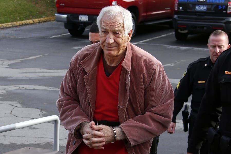 FILE - In this Oct. 29, 2015, file photo, former Penn State University assistant football coach Jerry Sandusky arrives at the Centre County Courthouse in Bellefonte, Pa., for a hearing about his appeal. Judge John Foradora, handling the pending re-sentencing of Sandusky, is recusing himself, citing an unspecified recent action by the attorney general&#039;s office. (AP Photo/Gene J.