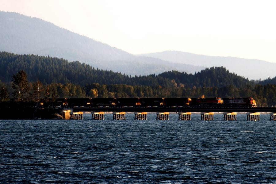 A train crosses Lake Pend Oreille on Sept. 16, 2014, as it leaves Sandpoint, Idaho.
