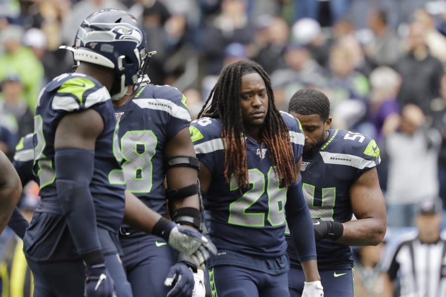 Seattle Seahawks&#039; Shaquill Griffin (26) and teammates walk off the field late in the second half of an NFL football game against the New Orleans Saints, Sunday, Sept. 22, 2019, in Seattle. (AP Photo/Ted S.