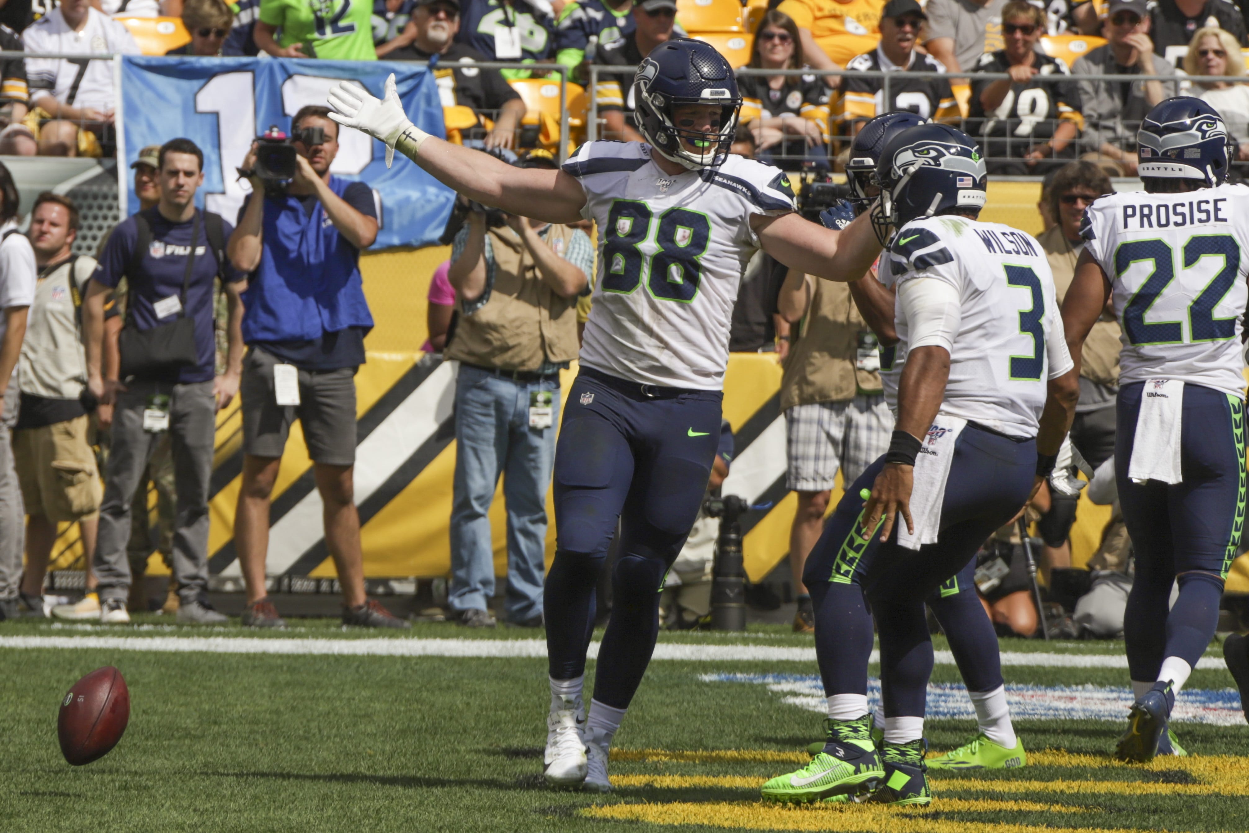 Seattle Seahawks tight end Will Dissly (88) celebrates with quarterback Russell Wilson (3) after making a touchdown catch against the Pittsburgh Steelers in the first half of an NFL football game, Sunday, Sept. 15, 2019, in Pittsburgh. (AP Photo/Gene J.