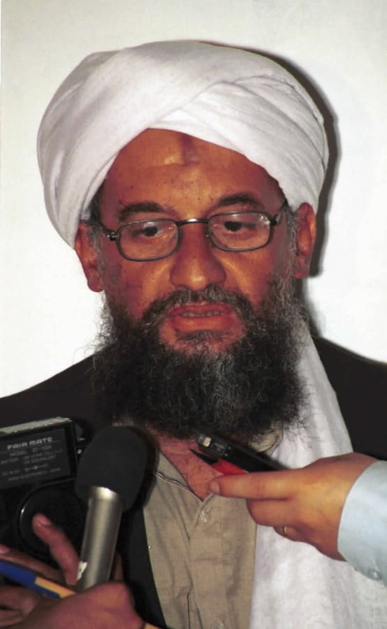 FILE - In this in this 1998 file photo made available Friday, March 19, 2004, Ayman al-Zawahri speaks to the press in Khost, Afghanistan. On Wednesday, Sept, 11, 2019, Al-Qaeda leader al-Zawahri called on all Muslims to attack U.S., European, Israeli and Russian targets in a speech on the 18th anniversary of the 9/11 terror attacks. SITE Intelligence Group reports that in a video released by the militant group, al-Zawahri also criticized “backtrackers” from jihad.