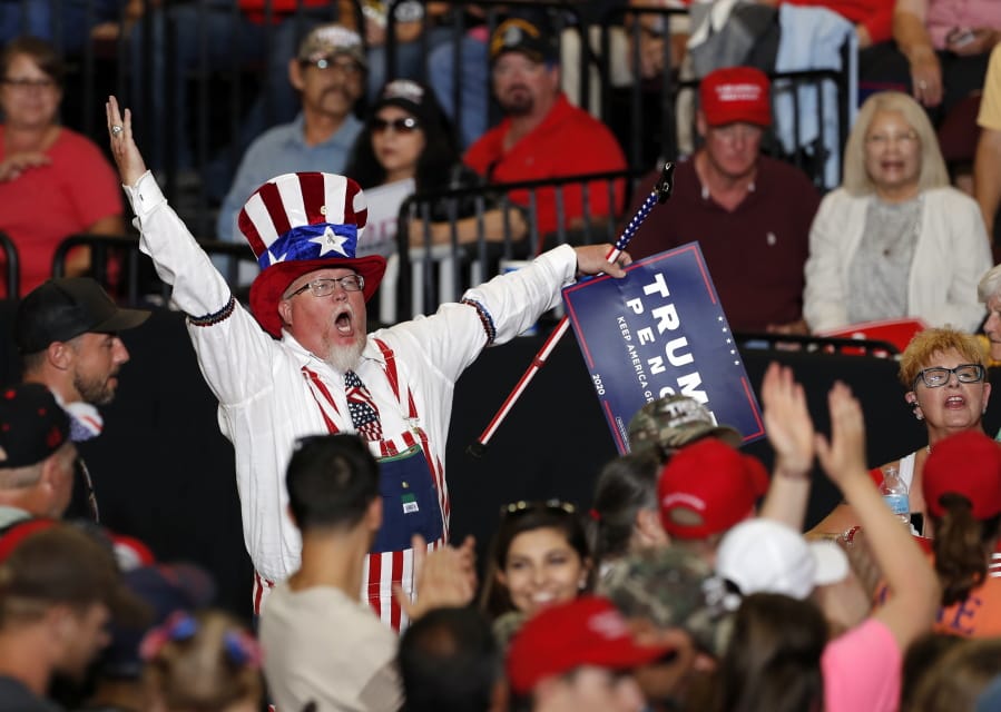 A supporter of President Donald Trump reacts upon his arrival to a campaign rally at the Santa Ana Star Center, Monday, Sept. 16, 2019, in Rio Rancho, N.M.
