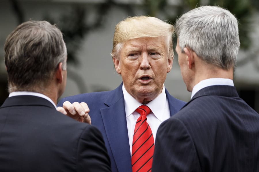 President Donald Trump pauses to talk as he leaves a ceremony with members of law enforcement on the South Lawn of the White House in Washington, Thursday, Sept. 26, 2019. The president was given a plaque of appreciation from America&#039;s Sheriffs and Angel Families.