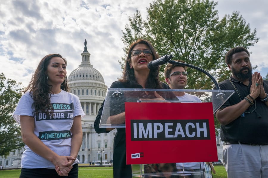 Rep. Rashida Tlaib, D-Mich., a member of the House Committee on Oversight and Reform, speaks as people rally for the impeachment of President Donald Trump, at the Capitol in Washington, Thursday, Sept. 26, 2019. Speaker of the House Nancy Pelosi, D-Calif., committed Tuesday to launching a formal impeachment inquiry against Trump. (AP Photo/J.