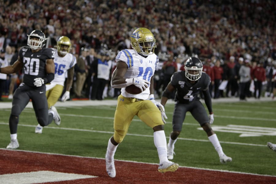 UCLA wide receiver Demetric Felton (10) scores the go ahead touchdown during the second half of an NCAA college football game against Washington State in Pullman, Wash., Saturday, Sept. 21, 2019. UCLA won 67-63.