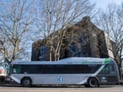 A C-Tran bus is seen here in front of the Vancouver Community Library in February.  A woman has sued C-Tran after she says she suffered head injuries when a C-Tran bus crashed into a bus shelter in downtown Vancouver in 2016.