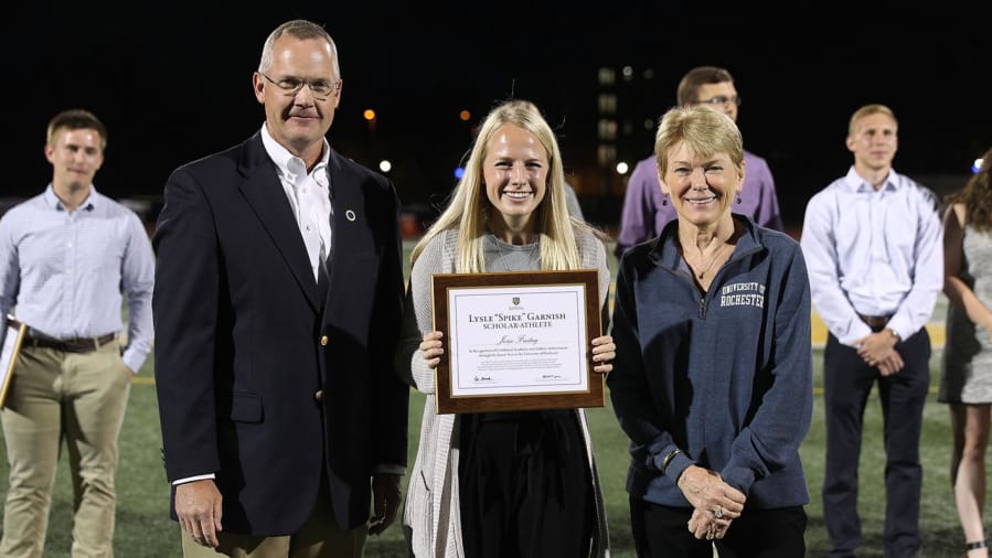 Jorie Freitag, center, was presented with the Granish Scholar Award by University of Rochester. Freitag captains in women&#039;s soccer team and is pursuing a degree in medicine.