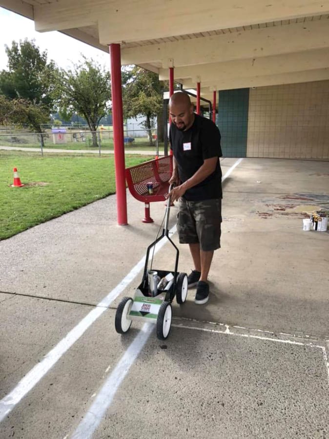 BATTLE GROUND: The local parent teachers organization for Glenwood Heights Primary School worked to beautify the playground recently.
