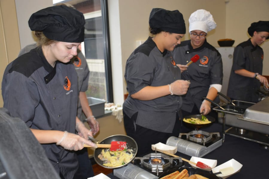 WASHOUGAL: Washougal High School Advanced Culinary students Zoie Petersen, Jovanna White, Ashlyn James and Rebecca McDonald work to serve up pasta to students and faculty on Sept.