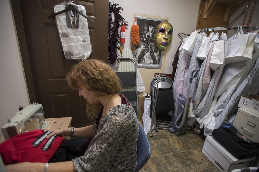 Center Stage Clothiers owner Diana Kirkpatrick works on a pirate costume for a production of &quot;Peter Pan&quot; at Evergreen High School this fall. Local schools are a large part of the business, which she opened in January 2018.