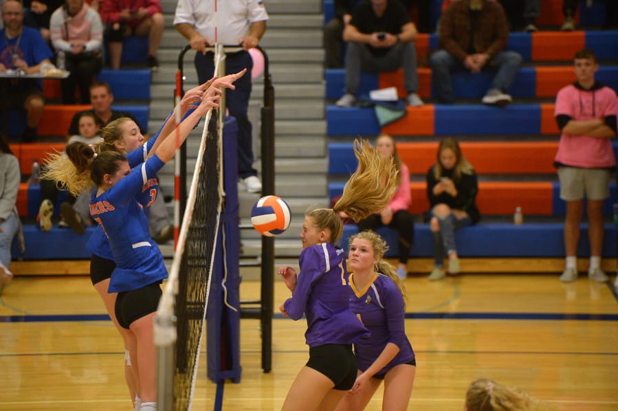 Ridgefield&#039;s Allie Andrew and Delaney Nicoll stuff Columbia River&#039;s Isabella Ness during Tuesday&#039;s 2A Greater St. Helens League match at Ridgefield High School.