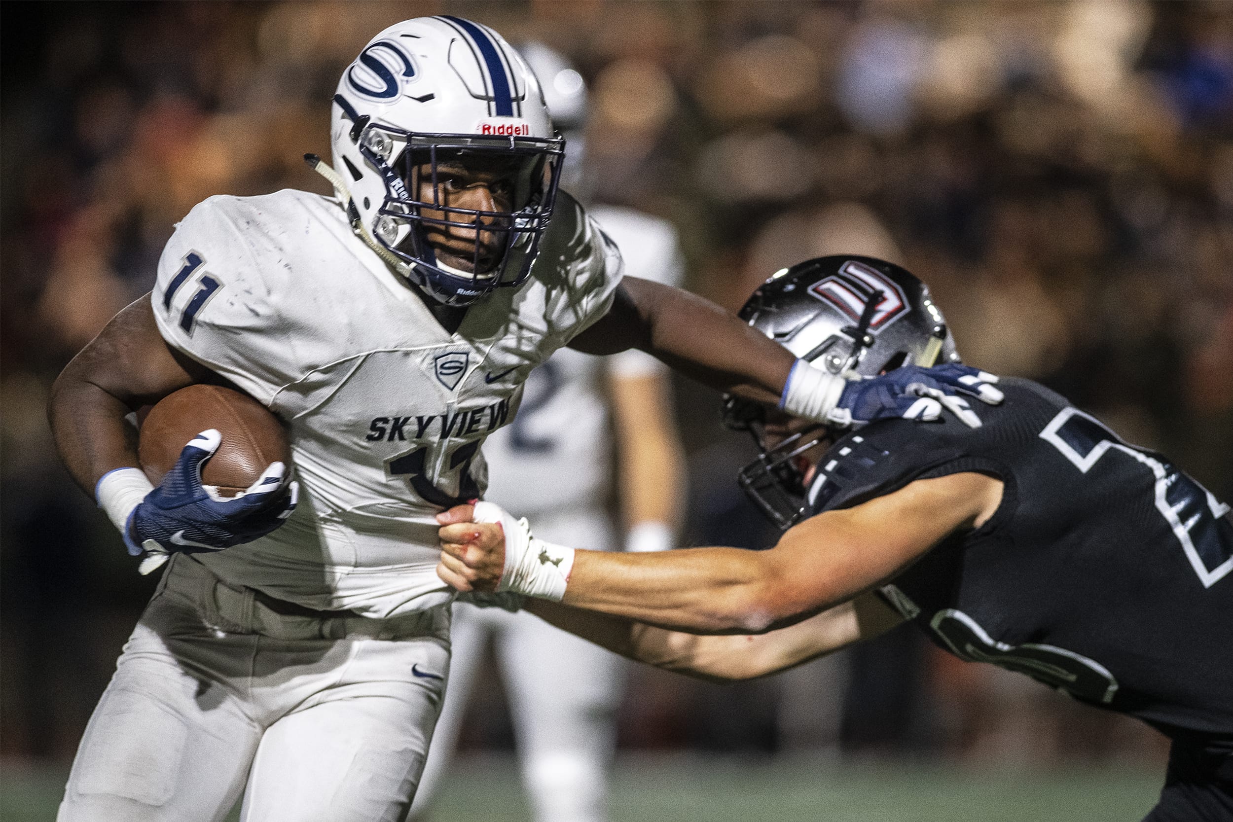 Skyview’s Jalynnee McGee breaks a tackle from a Union defender while running he ball in a game at McKenzie Stadium on Friday night, Oct. 11, 2019.