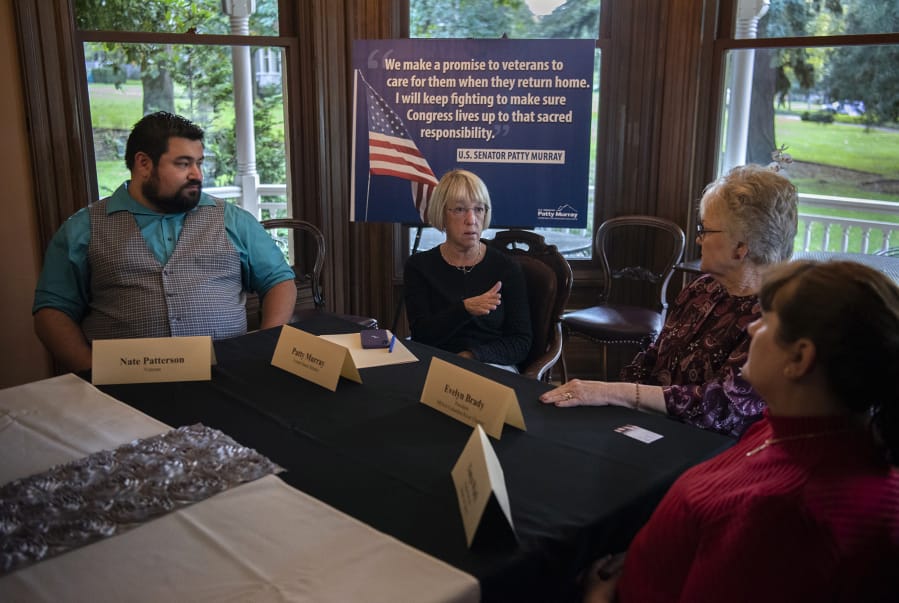 U.S. Sen. Patty Murray, second from left, discusses veterans’ health care issues on Wednesday with military veterans Nate Patterson, from left, Evelyn Brady and Tonya Wark at The Marshall House in Vancouver. Murray was looking for feedback on a new health care system administered by the Department of Veterans Affairs.