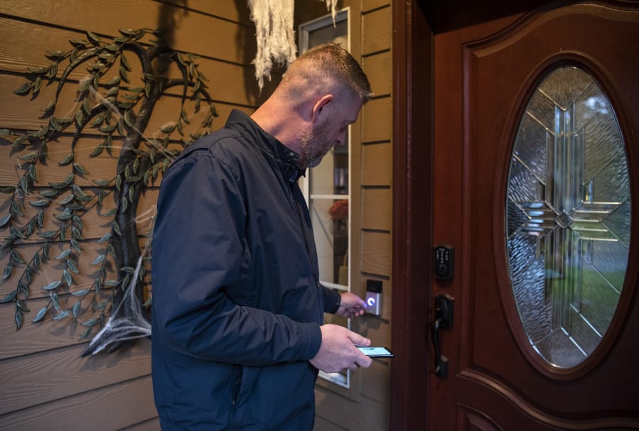 Matt Wiles shows off his Ring camera system at his home in east Vancouver on Wednesday. Wiles was an early adopter of the home camera system and purchased one right after they were released in 2013.