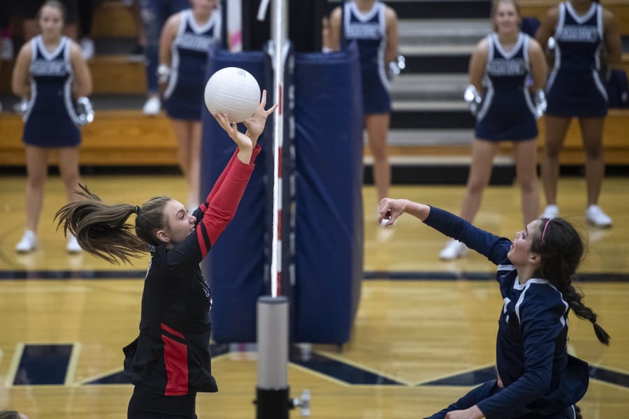 Camas&#039; Alliyah Barnes blocks a hit from Skyview&#039;s Allyson Reid during the 4A Greater St. Helens League match Tuesday at Skyview. Camas won 3-0.