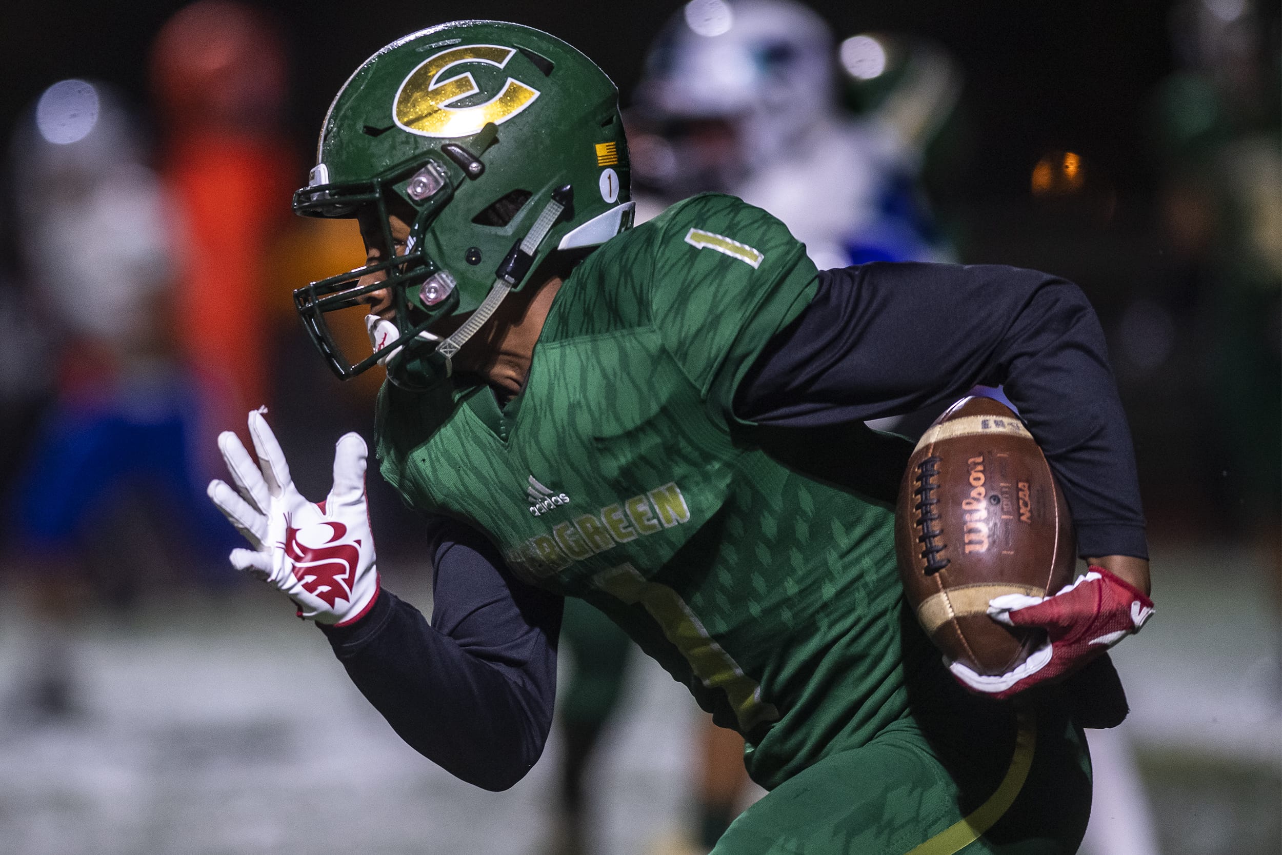 Evergreen Zyell Griffin runs the ball against Mountain View during a game at McKenzie Stadium on Friday night, Oct. 18, 2019.