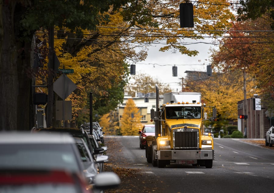 Cars and trucks make their way along Mill Plain Boulevard between Main Street and Broadway on Monday. Road improvements will change that section of the road to make it more accessible to truck traffic, as well as to cyclists and pedestrians.