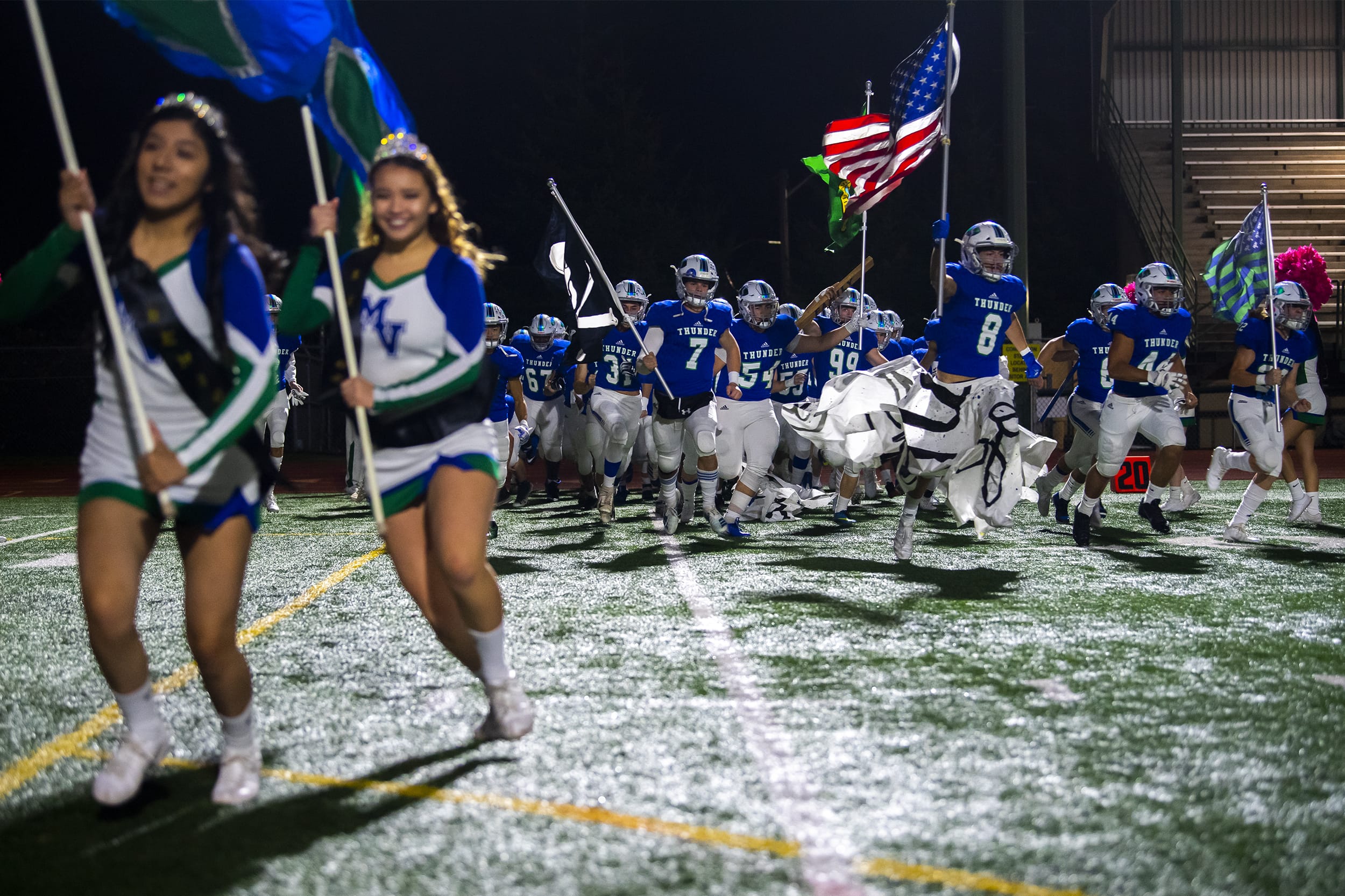 Mountain View runs onto the field before a game against Kelso at McKenzie Stadium on Friday night, Oct. 25, 2019.