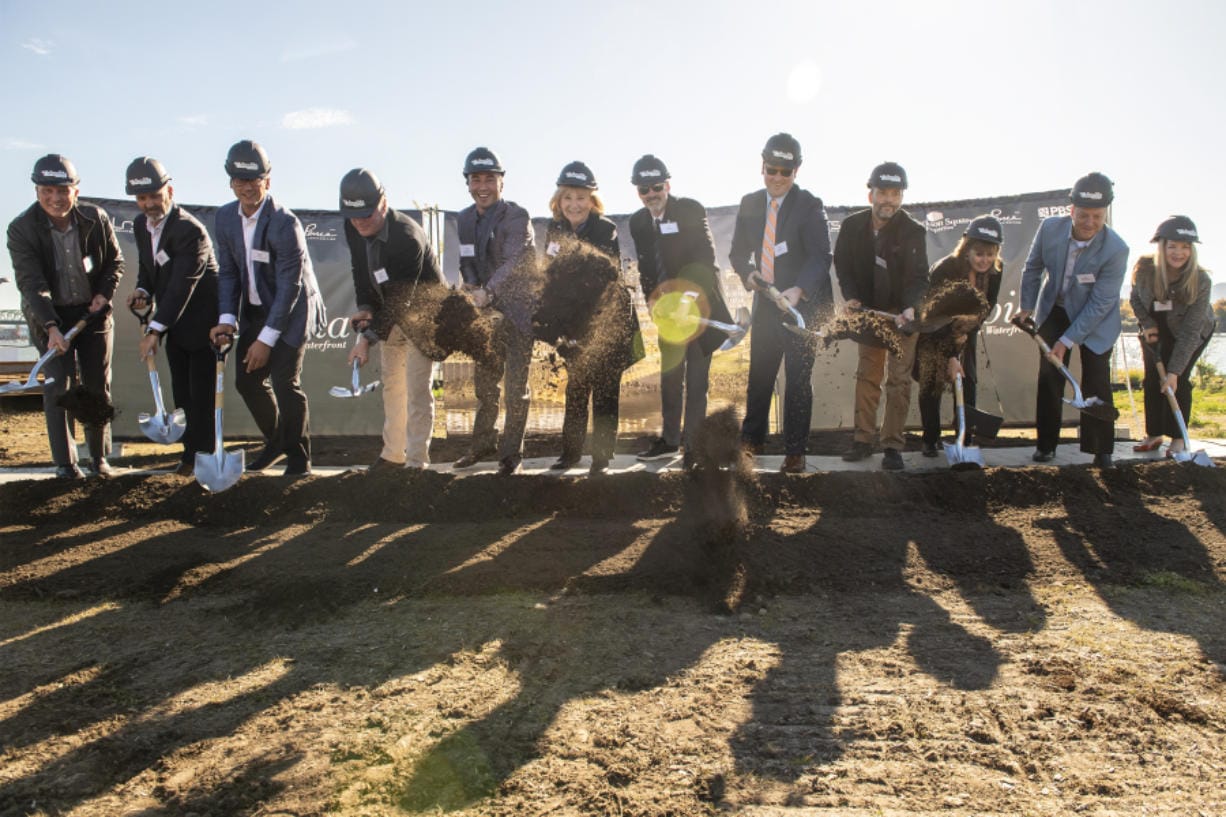 Vancouver Mayor Anne McEnerny-Ogle, Vancouver City Manager Eric Holmes and members of other involved companies break ground on The Columbia at the Waterfront on Wednesday afternoon.