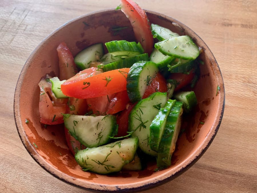 Tiflis salad with cucumber and tomato in a light walnut oil with fresh dill at Dediko.