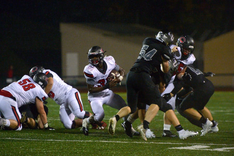 Camas running back Jacques Badolato-Birdsell finds a hole in the Union defense at McKenzie Stadium in Vancouver on Friday, October 26, 2018. Union beat Camas 14-7.