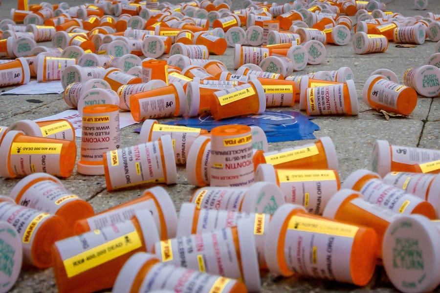 Protesters dropped hundreds of fake prescription bottles of OxyContin during a demonstration last month in front of Purdue Pharma headquarters in Stamford, Conn. Purdue is the manufacturer of OxyContin.