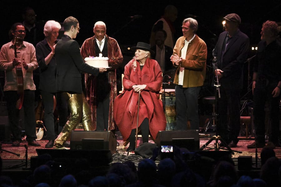 Joni Mitchell is presented with a birthday cake on stage at JONI 75: A Birthday Celebration on Wednesday, Nov. 7, 2018, at the Dorothy Chandler Pavilion in Los Angeles.