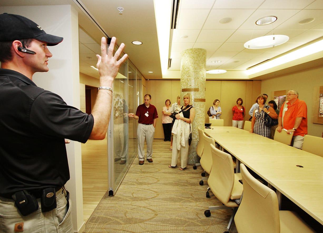 Chad Hillard, of Howard S. Wright Contractors, gives a tour of PeaceHealth Southwest Medical Center&#039;s Kearney Breast Center in July 2009.