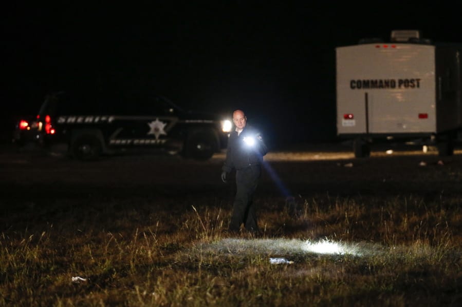 Authorities work the scene Sunday after a deadly shooting in Greenville, Texas. A gunman opened fire at an off-campus Texas A&amp;M University-Commerce party, which left over a dozen injured before he escaped in the ensuing chaos, a sheriff said Sunday.