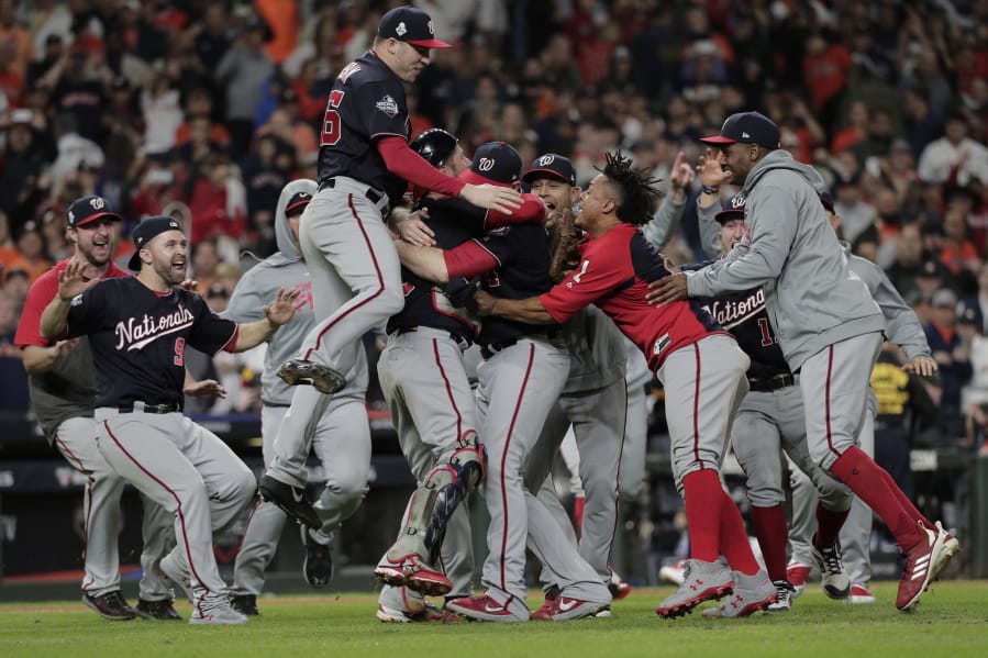 The Washington Nationals celebrate after Game 7 of the baseball World Series against the Houston Astros Wednesday, Oct. 30, 2019, in Houston. The Nationals won 6-2 to win the series. (AP Photo/David J.