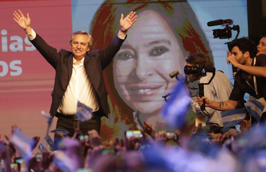 Peronist presidential candidate Alberto Fern?ndez waves to supporters in front of a large image of his running mate, former President Cristina Fern?ndez, after incumbent President Mauricio Macri conceded defeat at the end of election day in Buenos Aires, Argentina, Sunday, Oct. 27, 2019.