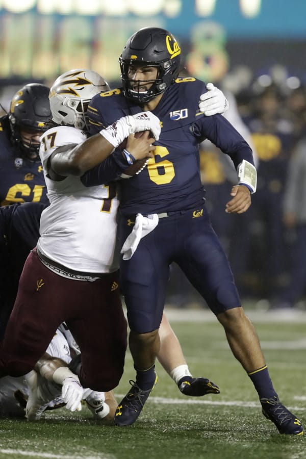 Arizona State&#039;s George Lea, left, tackles California quarterback Devon Modster (6) in the first half of an NCAA college football game, Friday, Sept. 27, 2019, in Berkeley, Calif.
