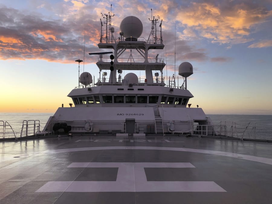 The sun rises Friday over Vulcan Inc.&#039;s research vessel Petrel nearly 200 miles off Midway Atoll in the Northwestern Hawaiian Islands.